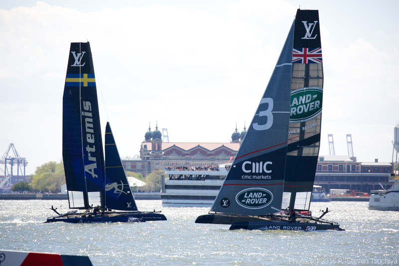 Sweden's Artemis Racing and Britain's Land Rover BAR work their way toward the crowd.