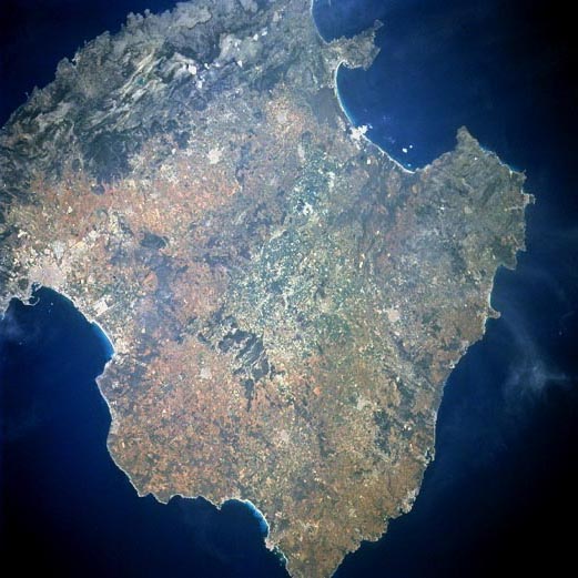 Mallorca, the largest of the Balearic Archipelago (1405 square miles-3640 sq. km), which is located in the Mediterranean Sea east of Spain.